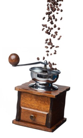 Téléchargez les photos : Coffee Grinder fly float in air, vintage Coffee mill for coffee bean to crush into ground powder over White background Isolated high speed shutter, freeze motion - en image libre de droit