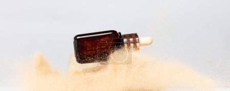 Photo for Perfume bottle product Sand flying explosion, lotion serum bottle sands grain wave explode. Abstract cloud fly. Perfume cosmetic advertising sea sand splash throwing in Air. White background Isolated - Royalty Free Image