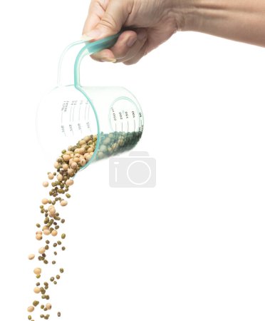 Photo for Mix green mung soy beans fall down explosion, several kind bean float pouring in measured cup. Dried soybean green mung mixed beans splash throwing in Air. White background Isolated high speed shutter - Royalty Free Image