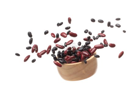 Photo for Mix black red beans fall down explosion, several kind bean float explode in wooden bowl. Dried red black mixed beans splash throwing in Air. White background Isolated high speed shutter, freeze motion - Royalty Free Image