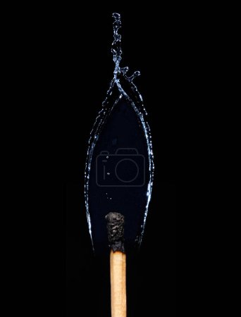 Photo for Close up burn out match, Match fire turn to shape water over black background. Concept Fire opposite to water or fantasy idea inspiration up side down - Royalty Free Image