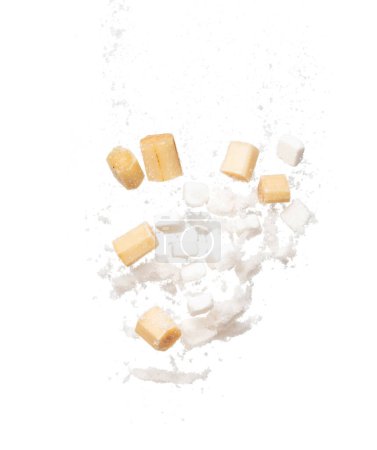 Photo for Pure Refined Sugar cane cube flying explosion, yellow chop sugarcane abstract cloud fly. Pure refined sugar sugarcane cut cubes splash stop in air, food object design. white background isolated - Royalty Free Image