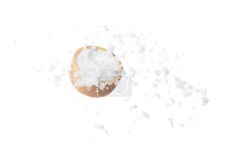 Photo for Refined Salt fall down pouring in wooden bowl, powder white salts explode abstract cloud fly. Small ground salt splash in air, food object element design. White background isolated high speed freeze - Royalty Free Image
