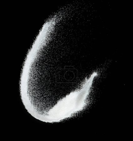 Photo for Million of white sand explosion, Photo image of falling down shower snow, heavy snows storm flying. Freeze shot on black background isolated overlay. Tiny Fine Salt sands as particle science - Royalty Free Image