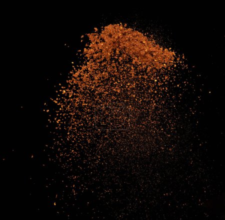 Photo for Red Hot Chilli flying explosion, red grain chilli explode abstract cloud fly. Beautiful complete seed chilly splash in air, food object design. Selective focus freeze shot black background isolated - Royalty Free Image