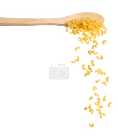 Photo for Macaroni fall on wooden spoon, yellow macaronis pasta float explode, abstract cloud fly. Curved macaroni pasta splash throwing in Air. White background Isolated high speed shutter, freeze motion - Royalty Free Image
