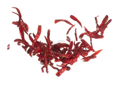 Foto de Dried Red hot Chilli fall down explosion, dried Red Chilli float explode, abstract cloud fly. Dried Red hot Chillis splash throwing in Air. White background Isolated high speed shutter, freeze motion - Imagen libre de derechos