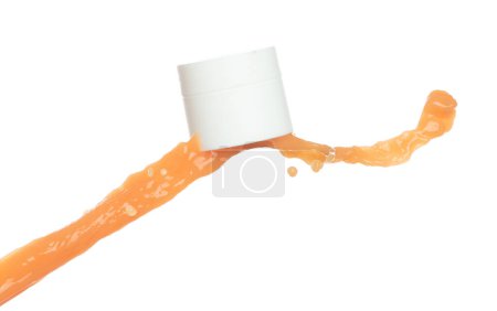Photo for Orange Juice moisturizer lotion cream pouring down in cosmetic bottle container. Orange paint beauty lotion fluttering explosion in air, splash spill like explosion droplet. White background isolated - Royalty Free Image