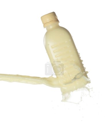 Photo for Tofu Soybean soymilk pour fall down in bottle container. Soybean milk or cosmetic cream moisturizer spill splash as paint color. White background isolated high speed shutter freeze motion - Royalty Free Image
