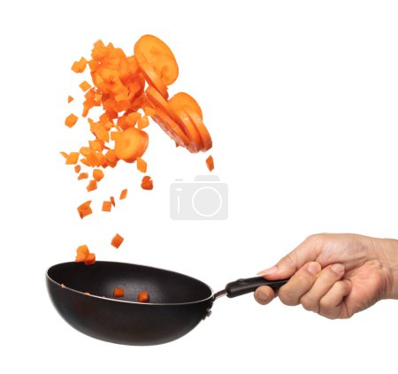 Foto de Carrot fresh fly float in Air turn to Cube dice mix with slice shape. Beta Carotene orange color in Carrot is good health. Many Dice cube carrot flying throw up in Air by cooking pan. White background - Imagen libre de derechos