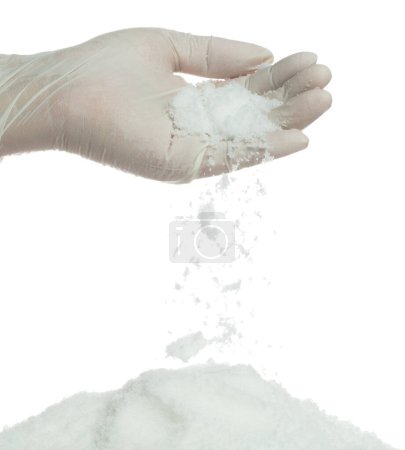 Photo for Salt pouring fall down from hand finger, great big white salts flower explode abstract cloud fall. Heap of Salt rock mix with ground powder, seasoning element design. White background isolated - Royalty Free Image