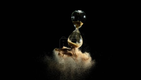 Photo for Hourglass fly in mid air, add more sand of time on gold sand over black background. Brown hourglass show more time Deadline extended time management hope concept hour glass, life clock passing by - Royalty Free Image