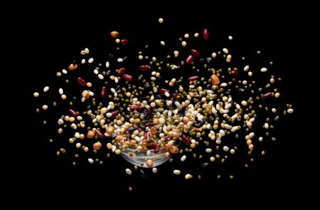 Photo for Mix beans fall down explosion, several multi kind bean float explode. Dried mixed white green red soy black peanut beans splash throwing in Air. Black background Isolated - Royalty Free Image