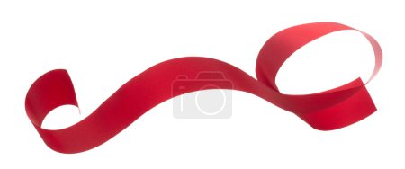 Photo for Red ribbon long straight fly in air with curve roll shiny. Red ribbon for present gift birthday party to wrap around decorate and make of textile cloth long straight. White background isolated - Royalty Free Image