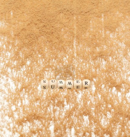 Photo for Alphabet letter wording "Summer" bead toy flying over sand explosion flying in air. Summer word alphabet letter show tropical island beach sand for vacation holiday. White background isolated - Royalty Free Image
