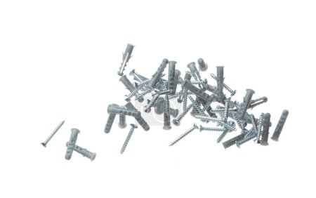 Photo for Flying Plastic gray dowel and screw in air. Expansion anchors, fixing dowel with chromed screw. Many pair of screw and dowel anchors floating in group. White background isolated - Royalty Free Image