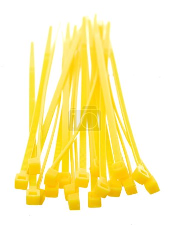Photo for Plastic Cable tie in yellow to hold cable together or wrap around things for electrician, maintenance, repair man. Close up Plastic Cable tie small size, white background isolated - Royalty Free Image