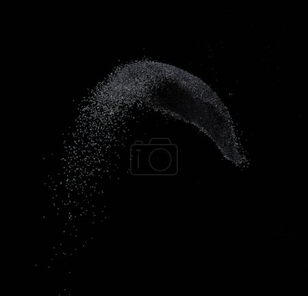 Photo for Million of black sand explosion, Photo image of falling down sands flying. Freeze shot on black background isolated overlay. Tiny Fine sand dust magnet as particle disintegrate science - Royalty Free Image
