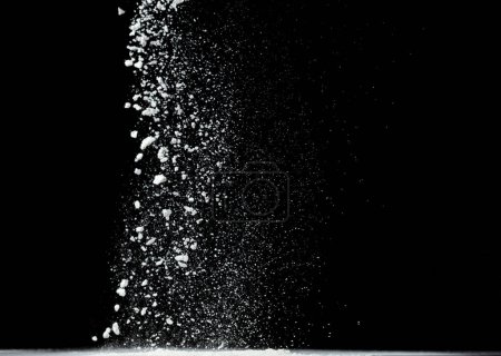 Photo for Tapioca starch flour fly explosion, White powder tapioca starch fall down in air. Seasoning flour powder is element material. Eyeshadow crush make up. Black background Isolated selective focus blur - Royalty Free Image