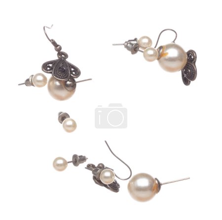 Photo for Fashion pearl Earrings with beautiful work detail is value. Luxury deep sea pearl diamond earring is fashion trend and fly in air. White background isolated - Royalty Free Image