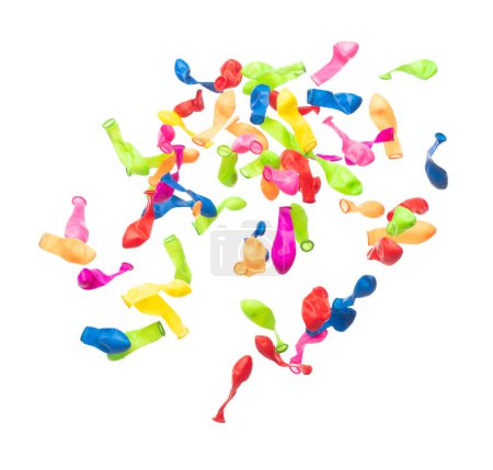 Photo for Deflated rubber colorful balloons fly in air. Many colorful deflated balloons in red, blue, yellow throw scatter. Toy for kid to play in birthday party and celebrate, white background isolated - Royalty Free Image