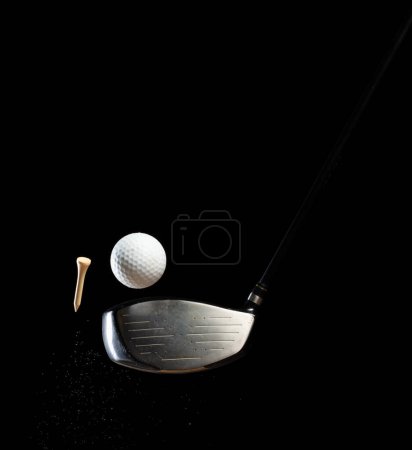 Photo for Golf ball tee explode from sand bunker. Golfer hit ball with club to sand explosion to green. Golf club hit ball tee in sand bunker explosion. Black background isolated freeze motion - Royalty Free Image
