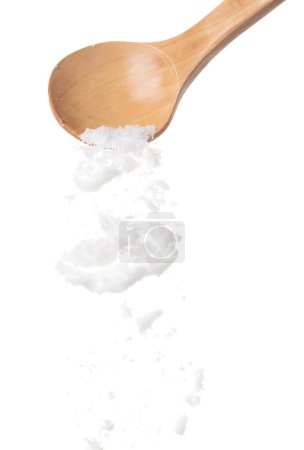 Photo for Refined Salt fall down pouring in wooden spoon, powder white salts explode abstract cloud fly. Small ground salt splash in air, food object element design. White background isolated high speed freeze - Royalty Free Image