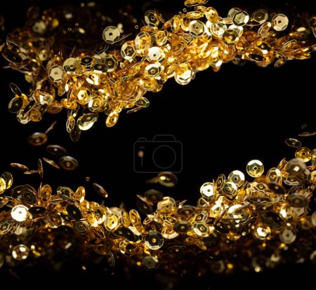 Photo for Explosion metallic gold glitter sequin sparkle. Golden Glitter sequin spark blink celebrate, blur foil explode in air, fly throw gold particle. Black background isolated, selective focus Blur bokeh - Royalty Free Image