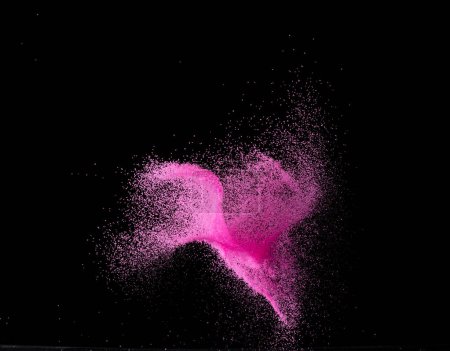 Photo for Pink Sand flying explosion, particle dot grain wave explode. Abstract cloud fly. Choky pink colored sand splash throwing in Air. Black background Isolated series two of images - Royalty Free Image