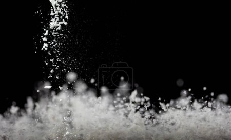Photo for Tapioca starch flour fly explosion, White powder tapioca starch fall down in air. Seasoning flour powder is element material. Eyeshadow crush make up. Black background Isolated series two of images - Royalty Free Image