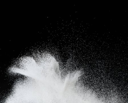 Photo for Million of white sand explosion, Photo image of falling down shower snow, heavy snows storm flying. Freeze shot on black background isolated overlay. Tiny Fine Salt sands as particle science - Royalty Free Image