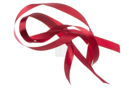 Photo for Red ribbon long straight fly in air with curve roll shiny. Red ribbon for present gift birthday party to wrap around decorate and curl curve long straight. White background isolated - Royalty Free Image