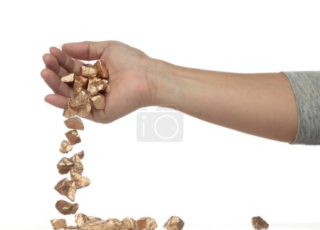 Photo for Gold ore nugget fall from industrial Miner hand fingers. Many pieces Golden nugget ore stone gravel found in hand of gold Mining industry. White background Isolated throwing freeze stop motion - Royalty Free Image