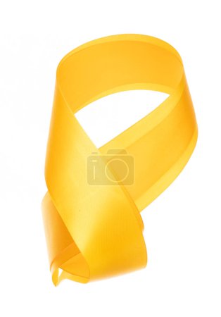 Photo for Yellow Gold ribbon long straight fly in air with curve roll shiny. Yellow Golden ribbon for present gift birthday party to wrap around decorate and make of long straight. White background isolated - Royalty Free Image
