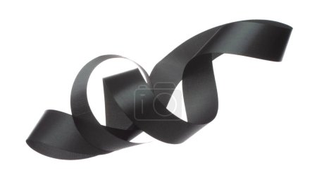 Photo for Black ribbon long straight fly in air with curve roll shiny. Black ribbon for present gift birthday party to wrap around decorate and make of textile cloth long straight. White background isolated - Royalty Free Image