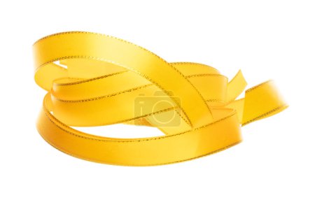 Photo for Gold Yellow ribbon long straight fly in air with curve roll shiny. Golden yellow ribbon for present gift birthday party to wrap around decorate and curl curve long straight. White background isolated - Royalty Free Image