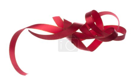 Photo for Red ribbon long straight fly in air with curve roll shiny. Red ribbon for present gift birthday party to wrap around decorate and curl curve long straight. White background isolated - Royalty Free Image