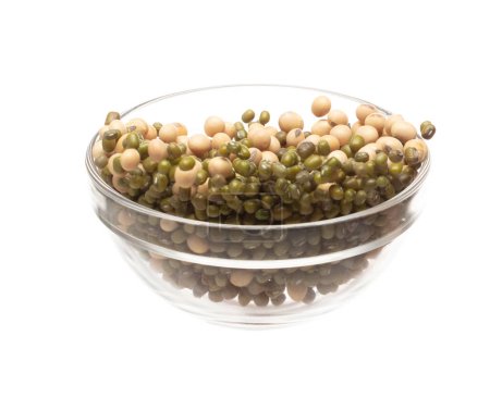 Mix green mung soy beans fall down explosion, several kind bean float explode in glass bowl. Dried soybean green mung mixed beans splash throwing in Air. White background Isolated high speed shutter