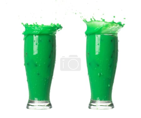 Photo for Green Matcha Milk Tea pour fall down, explosion in air. Green Matcha Milk Tea spill splash in shape glass bowl as paint color. White background isolated high speed shutter freeze motion - Royalty Free Image