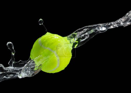 Photo for Tennis ball hit water and splash in air. Green Tennis ball fly in rain and splatter spin splash in droplet water. Black background isolated freeze action - Royalty Free Image