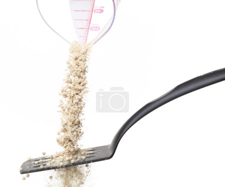 Photo for White Pepper seeds fall down pour in wooden spoon, white Pepper mix powder float explode, abstract cloud fly. Peppercorn mix powder splash throwing in Air. White background Isolated high speed shutter - Royalty Free Image