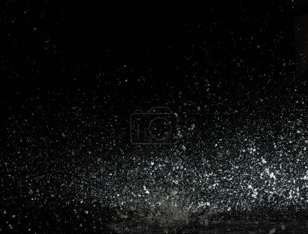 Photo for Throwing of Water splashes into drop water attack fluttering in wall floor and stop motion freeze shot. Splash Water for explosion texture graphic resource elements, black background isolated - Royalty Free Image