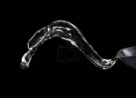 Photo for Shape form throw of Water splashes into Line water in air and stop motion freeze shot. Shape form Water for clear texture graphic resource elements, black background isolated - Royalty Free Image
