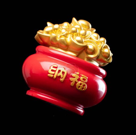 Photo for Chinese ornament gold ingot pot. Decoration element of chinese gold ingots or Yuanbao money for Festival. Other language mean rich wealthy prosperity. Black background isolated - Royalty Free Image