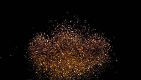 Photo for Ground Coffee roasted powder dust fly explosion, Coffee crushed ground float pouring. Roasted Coffee powder ground dust splash explosion in mid Air. Black background Isolated gold bokeh - Royalty Free Image