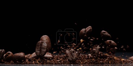 Photo for Coffee powder fly explosion, Coffee crushed ground float pouring, wave like smoke smell. Coffee ground powder splash throwing in mid Air. Black background Isolated selective focus blur - Royalty Free Image