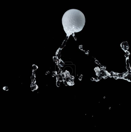 Photo for Golf ball hit water and splash in air. Golf ball fly in rain and splatter spin splash in droplet water. Black background isolated freeze action - Royalty Free Image
