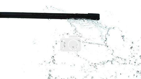 Photo for Wiper Blade Arm swipe heavy rain fall in drop wave on car vehicle. wiper blade arm work window on automobile with water rain spill droplet. White background isolated high speed shutter freeze motion - Royalty Free Image