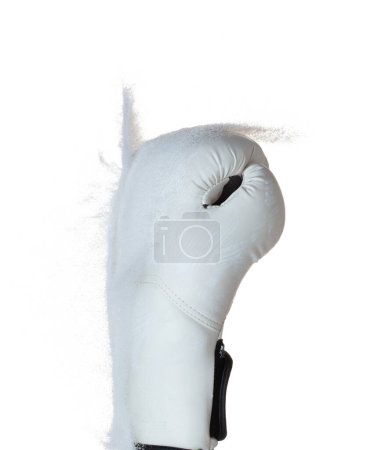 Photo for Boxing glove hit sand and explode. White Boxer glove impact sand splash as exercise training. White background isolated - Royalty Free Image