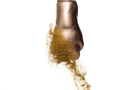 Photo for Boxing glove hit sand and explode. White Boxer glove impact gold yellow sand splash as exercise training. White background isolated - Royalty Free Image